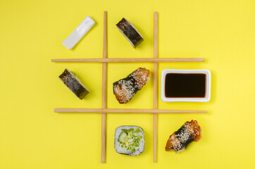 Creative Arrangement of Sushi and Sashimi on Yellow Background for Japanese Cuisine Concep