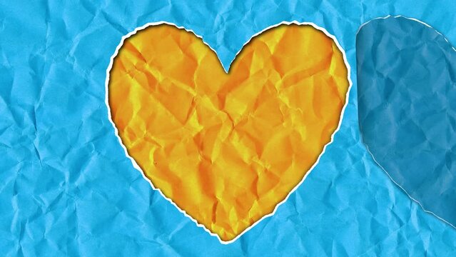 Torn paper in the shape of a heart in the colors of the Ukrainian flag