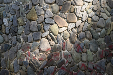 old wall made of real stone in the sun 1