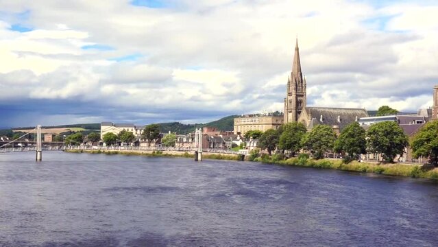 Panoramic view of the city of Inverness on the Isle of Skye, Scotland, on a cloudy and clear summer day.