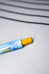 Obraz premium Cigarette Costs Wrapped in Euro Note: A Visual on Smoking Expenses