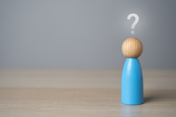 Man figurine with a question mark above his head. FAQ. Thoughts, reasoning and dreams....