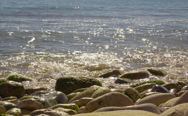 View of the Mediterranean Sea, large stones on the shore. sunny day. View of the Mediterranean Sea,...