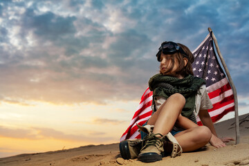 Little kid girl in goggles in sand desert 