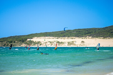 Kitesurfing on Valdevaqueros beach, Gibraltar Strait in Tarifa, Spain
