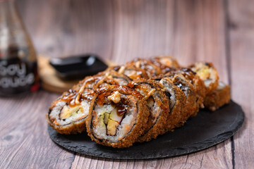 Perfectly prepared sushi, Sushi background, Eating sushi with dark soy sauce. Takeaway lunch box