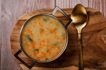 Chicken Ceram soup, Asian Thai food,Coconut Chicken Soup, Chicken soup in a small silver pot 