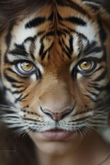 Intense and majestic, a bengal tiger's fierce gaze captivates as its sleek fur and piercing eyes draw you into the wild world of this iconic big cat