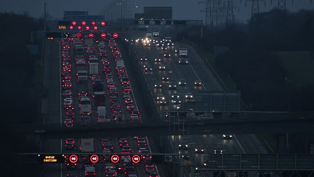 Luton, UK - February 11, 2024: Heavy evening traffic on busiest British motorway M1 near town Luton caused by long term roadworks on the motorway between junction 10 and 11.
