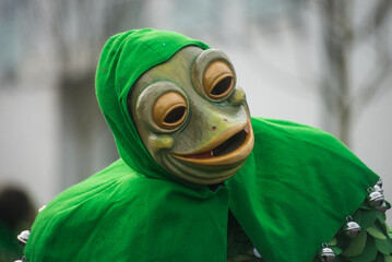 Neuenburg - Germany - 11 february 2024 - Portrait of masked frog people parading in the street - 733452407