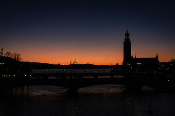silhouette of stockholm city hall at sunset