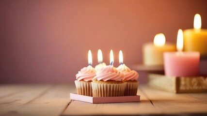 Birthday concept.Festive multi-colored cakes with candles in a cozy atmosphere on a wooden table.