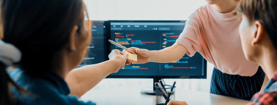 Closeup skilled young female programer present program coding and sharing programing idea while manager listening carefully.at modern office company. Java script, web design concept. Burgeoning.