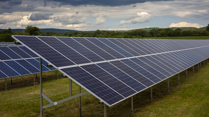 Solar panels placed behind the village to power households during cloudy skies
