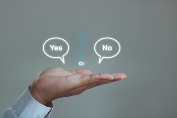 Think With Yes Or No 2 option concept. Business Choices For Difficult Situations. Man's hand holding yes or no word text bubble and question mark to check right or wrong, Making the true decision.