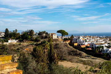 View of the village of Benalmadena, Andalusia, Spain. White houses in the distance and an azure sky.