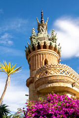 Details of the turret of Colomares Castle, Benalmadena, Andalusia, Spain. Beautiful castle on a background of flowers.