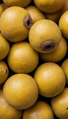 A close-up view of a group of ripe, vivid Marula with a deep, textured detail.