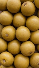 A close-up view of a group of ripe, vivid Marula with a deep, textured detail.