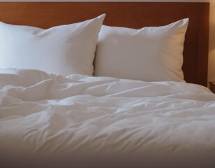 bed in a bedroom, white sheets, white bed linen, white bedroom