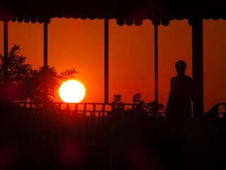 silhouette of a person at sunset