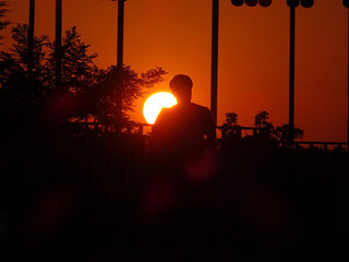 silhouette of a person at sunset