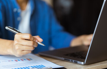 Businessmen, meeting financial information, and trading graphs, of business, through notebooks, online communication, investment advisors, and financial advisors.