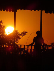 sunset in the city with silhoutte person
