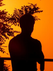 sunset in the city with silhoutte person