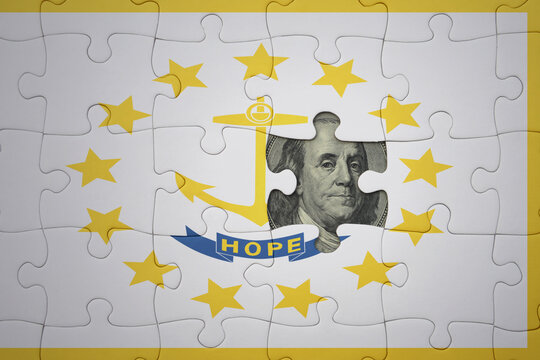 puzzle with the national flag of rhode island state and usa dollar banknote. finance concept