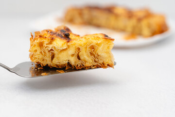 Slice of Phyllo dough pie with cream cheese filling close-up