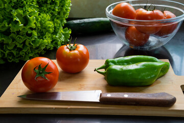 Healthy food. Vegetarian Food. Fresh and organic tomatoes, lettuce, peppers, cucumbers in a delicious salad