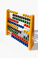 wooden children's abacus with colored beads to learn to count