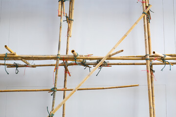 Bamboo scaffolding is installed around the building to support renovation or repaint.
