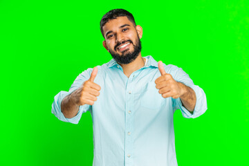 Like. Indian man raises thumbs up agrees with something or gives positive reply recommends...
