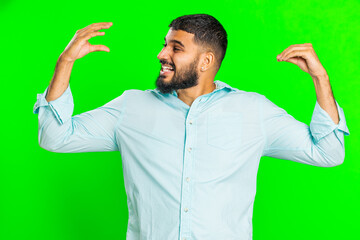 Disappointed Indian young man showing blah blah nonsense gesture with hands, not interested in...