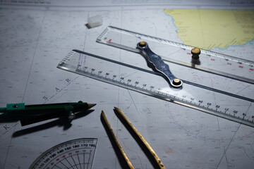 Look for maps before starting a voyage to determine sea navigation routes and navigation equipment such as calipers and rulers