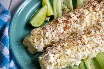 Mexican snack; Elotes with mayonnaise, cheese and chili powder