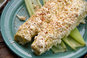 Mexican snack; Elotes with mayonnaise, cheese and chili powder