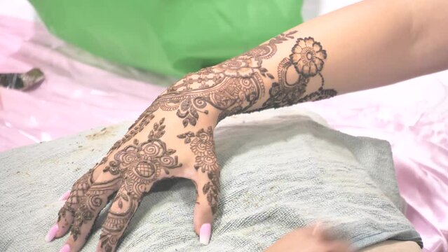 Tattoo henna mehndi design art painting drawn on the hand and leg for wedding
