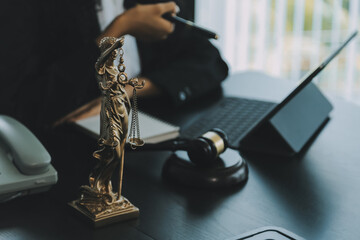 Judge gavel with Justice lawyers having team meeting at law firm background. Concepts of Law and...