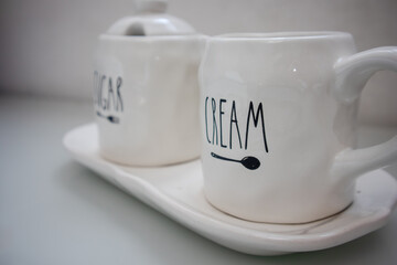 a set of coffee and tea cups, white