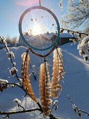 Dream catcher on winter background 