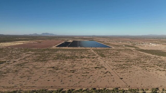 Aerial shot of a solar panel field in rural southern Arizona near picture rocks, wide aerial shot