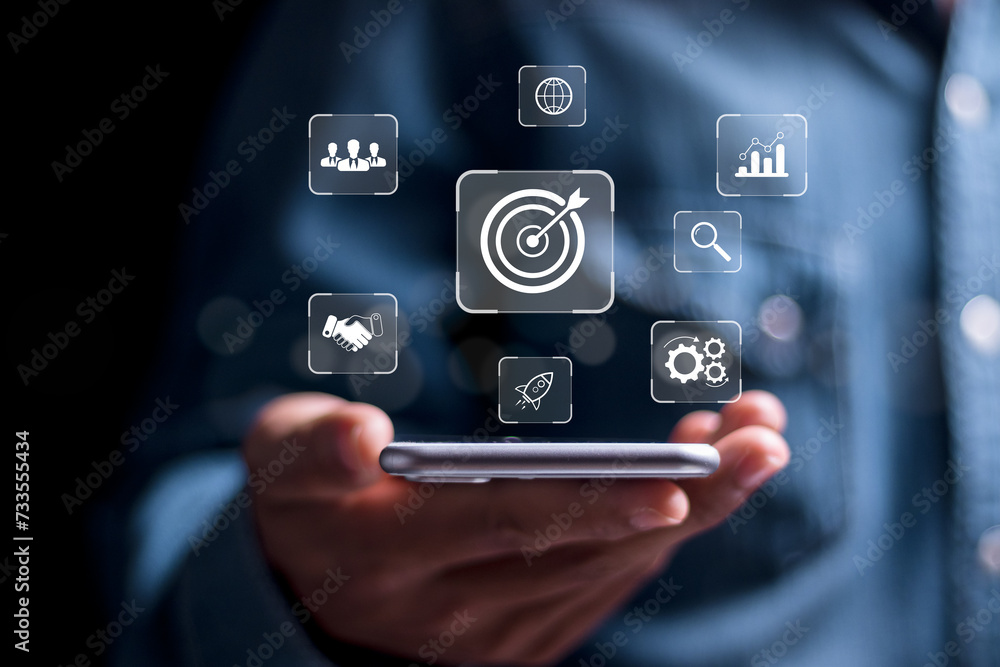 Poster targeting business concept. person use smartphone with virtual target icon for strategic planning to