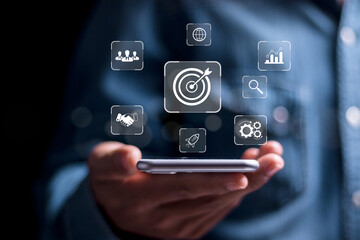 Targeting business concept. Person use smartphone with virtual target icon for strategic planning...