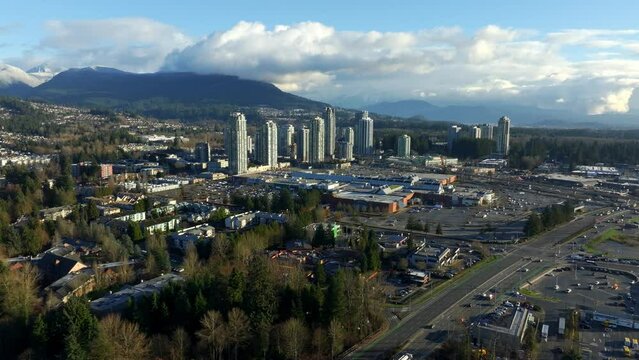 Skyscrapers And Shopping Mall In Town Centre Of Coquitlam In British Columbia, Canada. aerial sideways shot
