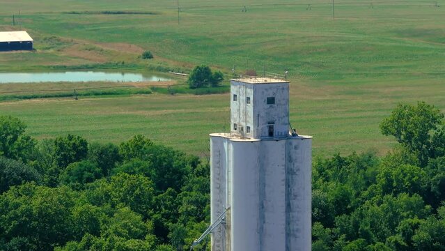 Fly toward large silo tower structure midwest kansas
