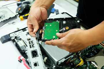 Computer repair technician and internal equipment, motherboard.