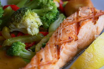 tasty salmon, mash potato and vegetable on plate 